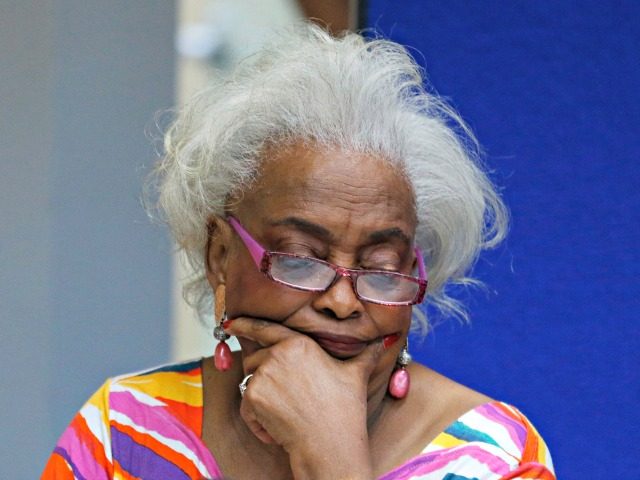 Brenda Snipes, Broward County Supervisor of Elections, looks at a ballot during a canvasin