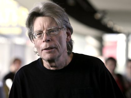 American author Stephen King poses for photographers on November 13, 2013 in Paris, before