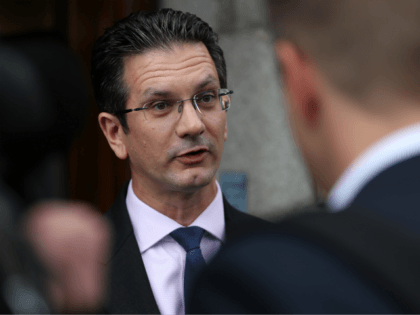 Conservative MP and former junior Brexit Minister, Steve Baker, speaks to members of the m