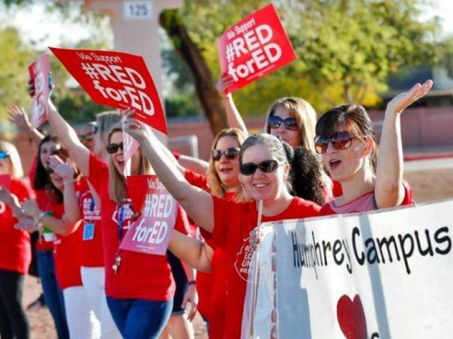 Teachers at Humphrey Elementary school participate in a state-wide walk-in prior to classe