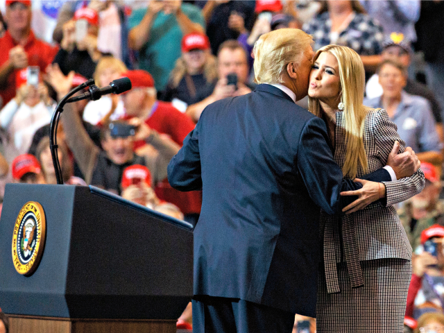President Donald Trump greets his daughter Ivanka Trump as she arrives to speaks during a