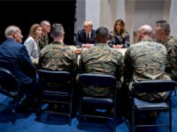 Trump-Melania-Marines-table-getty U.S. President Donald Trump, and First Lady Melania Trump listen while speaking to Marines with John Kelly, White House chief of staff, left, at Marine Barracks on November 15, 2018 in Washington, D.C. President Trump and the First Lady are meeting with Marines who responded to a building fire at …