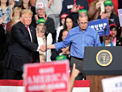 President Donald Trump thanks Senate candidate Mike Braun after he speaks at a campaign rally in Indianapolis, Friday, Nov. 2, 2018.