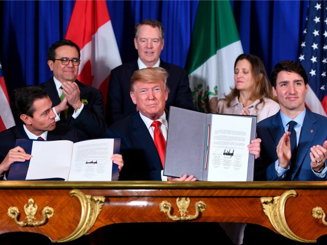 Mexico's President Enrique Pena Nieto (L) US President Donald Trump (C) and Canadian Prime Minister Justin Trudeau, sign a new free trade agreement in Buenos Aires, on November 30, 2018, on the sidelines of the G20 Leaders' Summit. - The revamped accord, called the US-Mexico-Canada Agreement (USMCA), looks a lot …