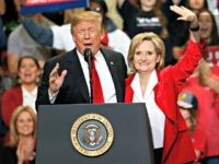 President Donald Trump encourages voters to support appointed Republican U.S. Sen. Cindy Hyde-Smith in a runoff race Tuesday against Democrat Mike Espy, as he speaks during a rally Monday, Nov. 26, 2018, in Biloxi, Miss.