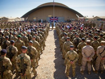 KANDAHAR, AFGHANISTAN - NOVEMBER 09: The national flag of the United Kingdom is displayed as British troops and service personal remaining in Afghanistan are joined by International Security Assistance Force (ISAF) personnel and civilians as they gather for a Remembrance Sunday service at Kandahar Airfield November 9, 2014 in Kandahar, …
