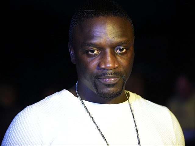 Rapper and songwriter Akon speaks during the unveiling ceremony of the Africa's first kinetic football pitch in Lagos, on December 10, 2015. The pitch combines solar energy with innovative technology that harnesses the energy of player's movement and converts into renewable electricity. The Lagos unveiling is second to the first …