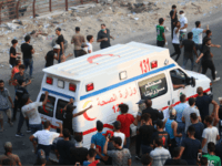 An Iraqi ambulance leaves during a protest against the government and the lack of basic services outside the regional government headquarters in the southern city of Basra on September 5, 2018. - Iraqi security forces opened fire on protesters today as the two sides clashed in the southern city of …