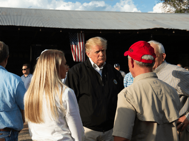 US President Donald Trump meets with farmers impacted by Hurricane Michael at a farm in Macon, Georgia, October 15, 2018. - President Donald Trump toured areas of Florida devastated by Hurricane Michael last week, and met some of the thousands of people still struggling to survive without running water or …