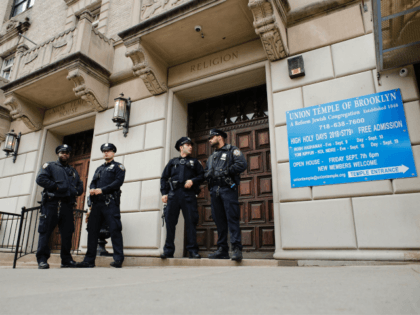Synagogues NYPD officers stand guard at the door of the Union Temple of Brooklyn on Novemb