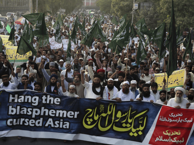 Supporters of Pakistani radical religious Tehreek-e-Labbaik party protest against a Christian woman Asia Bibi, in Lahore, Pakistan, Friday, Oct. 19, 2018. Supporters from an extremist Islamist party have rallied to pressure judges to uphold a death sentence for a Christian woman convicted of blasphemy. Banner reads, " O prophet of â¦