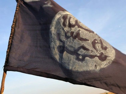 A Boko Haram flag flutters from an abandoned command post in Gamboru deserted after Chadian troops chased them from the border town on February 4, 2015. Nigerian Boko Haram fighters went on the rampage in the Cameroonian border town of Fotokol, massacring dozens of civilians and torching a mosque before …