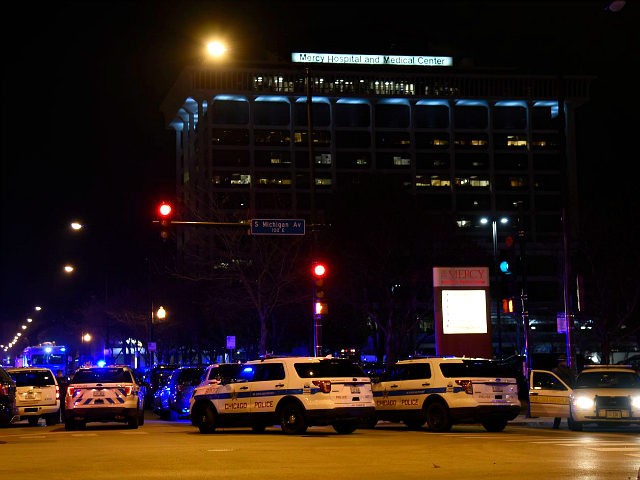Chicago Police work the scene where a gunman opened fire at Mercy Hospital, Monday, Nov. 1