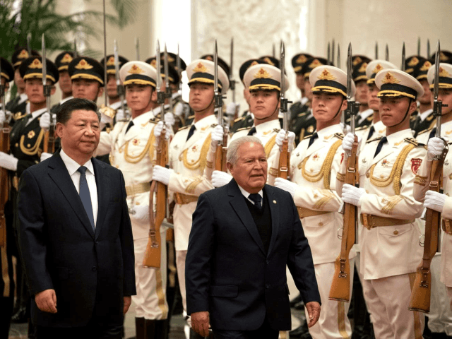 Salvadoran President Salvador Sanchez Ceren walks with Chinese President Xi Jinping during