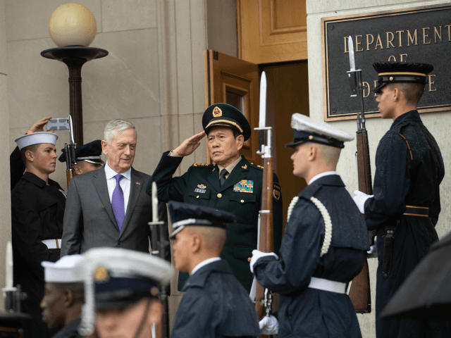 US Defense Secretary Jim Mattis and Chinese Defense Minister Gen. Wei Fenghe listen to national anthems prior to talks at the Pentagon in Washington, DC, on November 9, 2018. (Photo by NICHOLAS KAMM / AFP) (Photo credit should read NICHOLAS KAMM/AFP/Getty Images)
