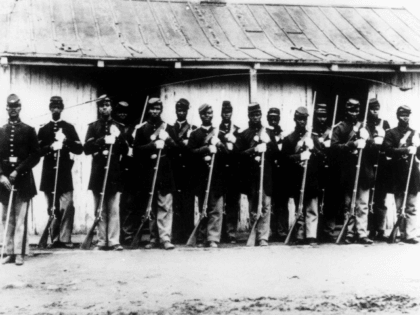 ADVANCE FOR USE SATURDAY, FEB. 6, AND THEREAFTER - FILE - This is an undated 1860's file photo of a military police detachment, known as provost guards, of the 107th U.S. Colored Infantry lined up at Fort Corcoran near Washington, D.C. It's been 150 years since black soldiers from U.S. …