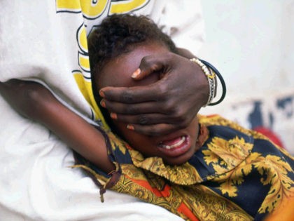 A six-year-old girl undergoes female genital mutilation in Somalia – which 95% of girls aged 4 to 11 face there. Photograph: Jean-Marc Bouju/AP