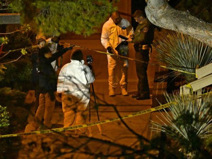 A forensics team works the scene Thursday, Nov. 8, 2018, in Thousand Oaks, Calif. where a gunman opened fire Wednesday inside a country dance bar crowded with hundreds of people on "college night," wounding 11 people including a deputy who rushed to the scene. Ventura County sheriff's spokesman says gunman …