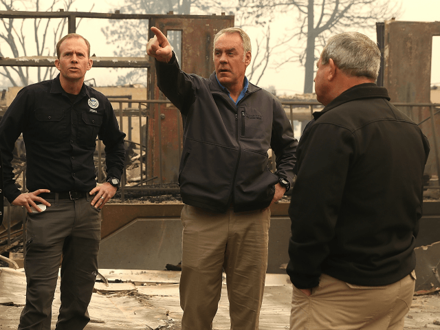 California Governor Jerry Brown and FEMA Adminstrator Brock Long and U.S. Secretary of the Interior Ryan Zinke tour a school burned by the Camp Fire on November 14, 2018 in Paradise, California. Fueled by high winds and low humidity, the Camp Fire ripped through the town of Paradise charring over …