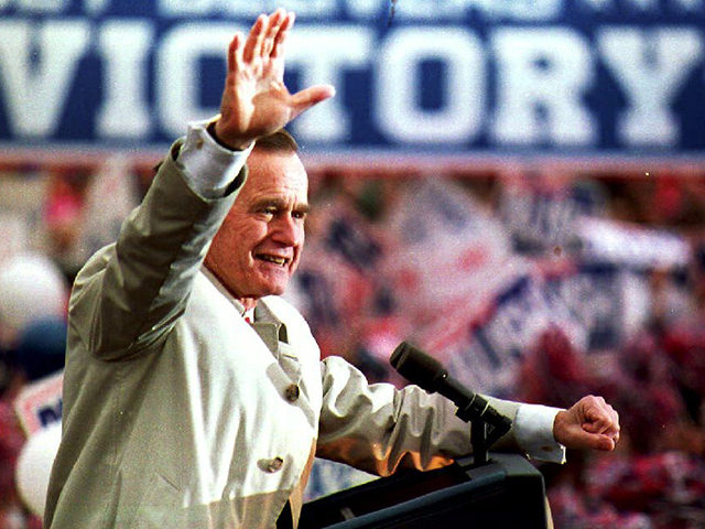 New Jersey: U.S. President George Bush waves to a group of supporters 02 November 1992 during a campaign stop at the Dodge Memorial Building. President Bush is trailing Democratic candidate Bill Clinton in the polls. (Photo credit should read J. DAVID AKE/AFP/Getty Images)