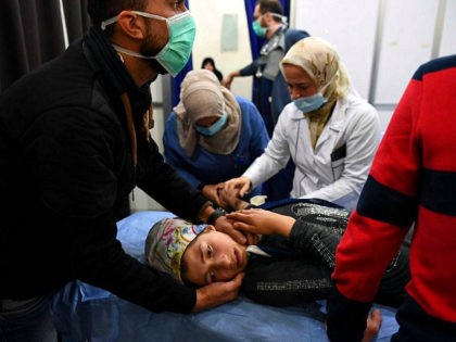 TOPSHOT - A Syrian girl receives treatment at a hospital in the regime controlled Aleppo on November 24, 2018. - Official Syrian media accused the armed opposition of launching an attack with 'toxic gas' on the northern city, but a leading rebel alliance has denied any involvement. (Photo by George …