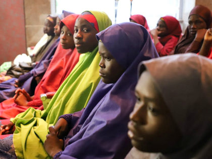 Released Nigerian school girls who were kidnapped from their school in Dapchi, in the northeastern state of Yobe, wait to meet the Nigerian president at the Presidential Villa in Abuja on March 23, 2018. The Nigerian president promised on March 23, 2018 to free the remaining Christian schoolgirl still held …