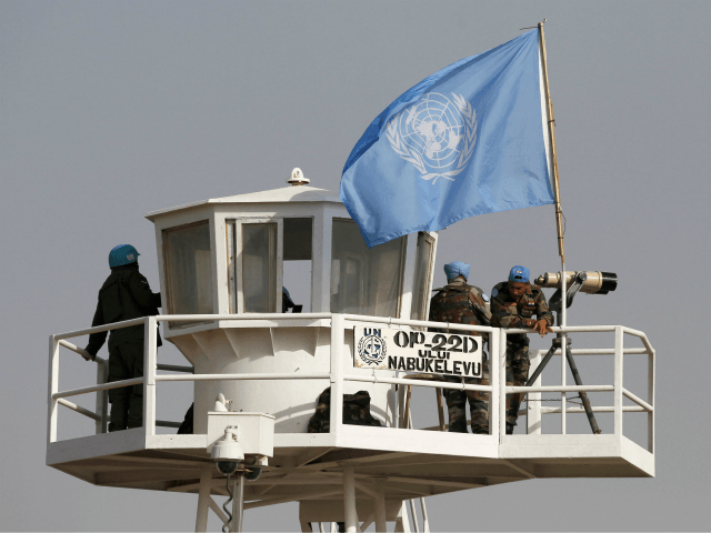 United Nations peacekeepers observe the Quneitra border crossing with Syria in the Israeli annexed-Golan Heights during its reopening on October 15, 2018. - The only crossing point between Syria and Israeli-controlled territory reopened on October 15, 2018, an AFP correspondent reported, four years after closing due to the civil war …
