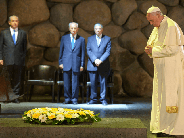 n this handout provided by the Israeli Government Press Office (GPO), Pope Francis visits the Yad Vashem Holocaust Museum with Israeli President Shimon Peres and Prime Ministrer Benjamin Netanyahu, on May 26, 2014 in Jerusalem, Israel. Pope Francis arrived in Israel on Sunday afternoon, a day after landing in the Middle East for his first visit to the Holy Land. During his visit to the West Bank the Pontiff addressed the Israeli-Palestinian conflict as 'unacceptable' and urged both sides to find courage in seeking a peaceful solution. (Photo by Amos Ben Gershom - GPO /Getty Images)