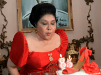 Philippine former first lady and now congresswoman, Imelda Marcos blows out the candles on a cake designed with a shoe during her 85th birthday celebration in Batac town, Ilocos norte, north of Manila on July 2, 2014. Imelda Marcos, the Philippines' most famous political survivor, toasted her 85th birthday July …