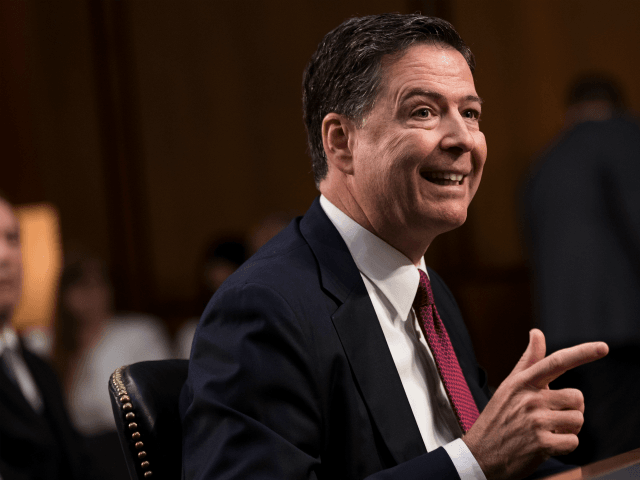 Former FBI Director James Comey testifies before the Senate Intelligence Committee in the