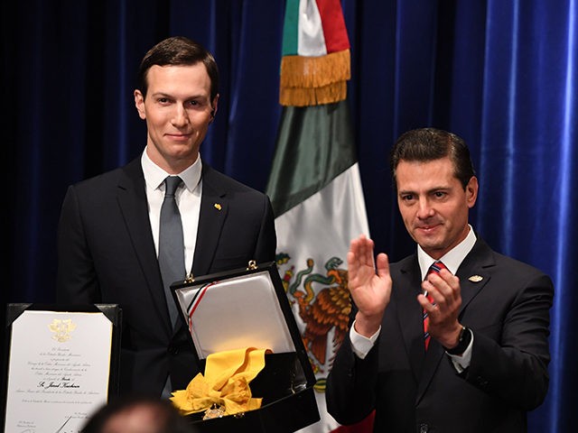 Senior Advisor to the President of the United States Jared Kushner (L) receives the Mexica