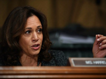 US Senator Kamala Harris, D-CA, talks to Christine Blasey Ford, the woman accusing Supreme Court nominee Brett Kavanaugh of sexually assaulting her at a party 36 years ago, during her hearing before the US Senate Judiciary Committee on Capitol Hill in Washington, DC, September 27, 2018. (Photo by SAUL LOEB …