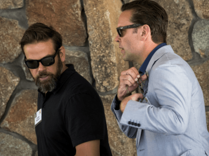 (L to R) Lachlan Murdoch, executive co-chairman of News Corp and 21st Century Fox, walks with brother James Murdoch, chief executive officer of 21st Century Fox, as they attend the annual Allen & Company Sun Valley Conference, July 5, 2016 in Sun Valley, Idaho. Every July, some of the world's …
