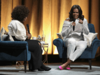 michelle obama CHICAGO, IL - NOVEMBER 13: Oprah Winfrey interviews former first lady Michelle Obama as she kicks off her 'Becoming' arena book tour on November 13, 2018 in Chicago, Illinois. In the book, which was released today, Obama describes her journey from Chicago's South Side to the White House. (Photo by …