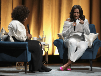 CHICAGO, IL - NOVEMBER 13: Oprah Winfrey interviews former first lady Michelle Obama as she kicks off her 'Becoming' arena book tour on November 13, 2018 in Chicago, Illinois. In the book, which was released today, Obama describes her journey from Chicago's South Side to the White House. (Photo by …