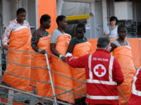 Women disembark from the Siem Pilot on October 24, 2016 after rescue operations of migrants at see during the week-end. During a dramatic 24 hours, the crew of the Norwegian Siem Pilot, a vessel built as an oil platform supply ship but now used by the EU border force Frontex …
