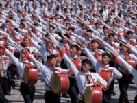 north korea Students march past a balcony from where North Korea's leader Kim Jong Un was watching, during a mass rally on Kim Il Sung square in Pyongyang on September 9, 2018. - North Korea held a military parade to mark its 70th birthday, but refrained from showing off the intercontinental ballistic …
