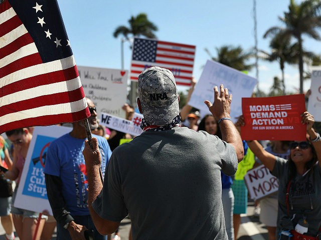 WEST PALM BEACH, FL - MARCH 24: A President Donald Trump supporter wearing an NRA hat (who