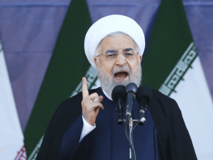 Iran's President Hassan Rouhani speaks at a military parade marking the 38th anniversary of Iraq's 1980 invasion of Iran, in front of the shrine of the late revolutionary founder, Ayatollah Khomeini, outside Tehran, Iran, Saturday, Sept. 22, 2018. Elsewhere gunmen disguised as soldiers attacked a annual parade in the southwestern …