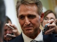 WASHINGTON, DC - SEPTEMBER 28: U.S. Sen. Jeff Flake (R-AZ) speaks to members of the media after a meeting in the office of Senate Majority Leader Sen. Mitch McConnell (R-KY) September 28, 2018 at the U.S. Capitol in Washington, DC. President Donald Trump has ordered a one-week-long supplemental FBI background …