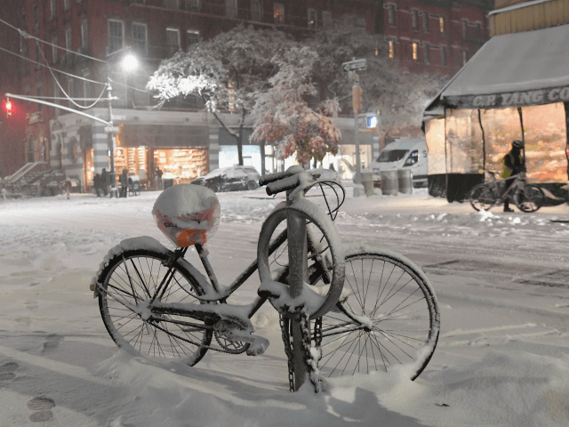 A bicycle covered in snow is seen in Manhattan on November 15, 2018 in New York . - The Na