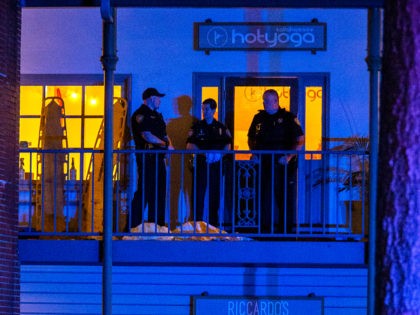 TALLAHASSEE, FL - NOVEMBER 02: Tallahassee Police officers are stationed outside the HotYoga Studio after a gunman killed one person and injured several others inside on November 2, 2018 in Tallahassee, Florida. The gunman also died from what appears a self inflicted gunshot wound according to police. (Photo by Mark …