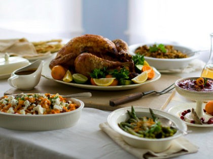 FILE- This Oct. 13, 2011 file photo shows a citrus turkey surrounded by side dishes in Con