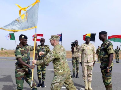 Senegal's Army General Amadou Kane (L) receives the 2016 Flintlock flag from US Army Gener