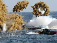 South Korean Marine amphibious assault vehicles fire smoke shells during a landing operation in the southern city of Pohang S. Korea, US resume suspended joint marine drills