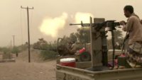 This image grab taken from a AFPTV video shows Yemeni pro-government forces firing a heavy machine gun at the south of Hodeida airport, in Yemen's Hodeida province on June 15, 2018