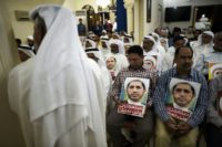 Supporters hold placards of Sheikh Ali Salman during a protest in Bahrain on May 29, 2016 against his arrest