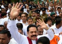 Parliament has been suspended while Rajapakse seeks support for a vote of confidence showdown by tempting defectors from other parties