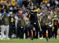 Pittsburgh quarterback Ben Roethlisberger scrambles out of the pocket in the Steelers 52-21 NFL rout of the Carolina Panthers
