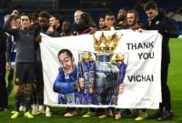 Leicester players hold a banner in honour of late owner Vichai Srivaddhanaprabha after their Premier League win against Cardiff